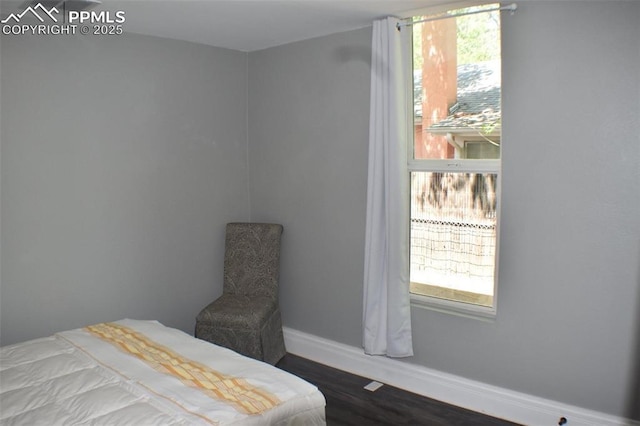 305 W 2nd St, Florence, CO 81226 - bedroom with baseboards and dark wood finished floors