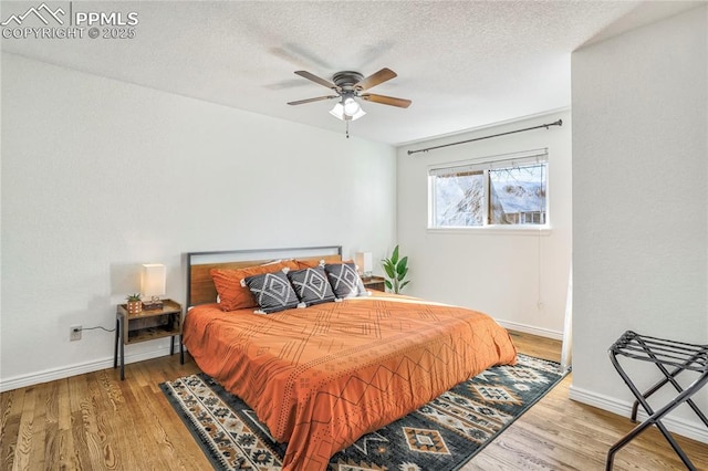 1633 N Chestnut St, Colorado Springs, CO 80907 - bedroom with wood finished floors, a textured ceiling, and a ceiling fan