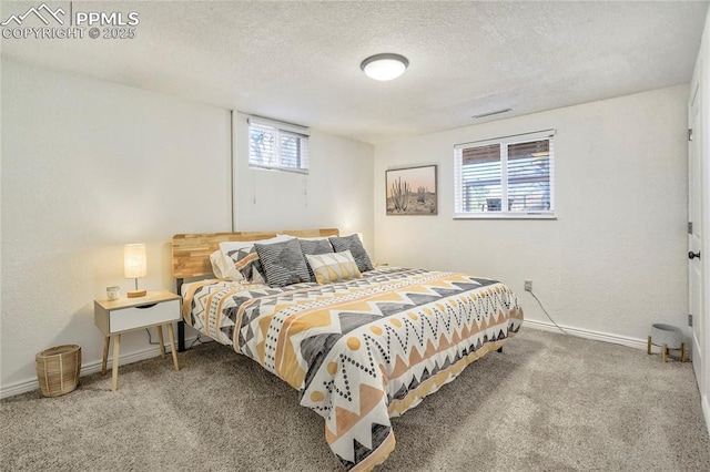 1633 N Chestnut St, Colorado Springs, CO 80907 - carpeted bedroom featuring baseboards and a textured ceiling