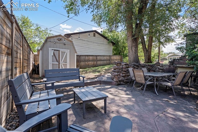 1633 N Chestnut St, Colorado Springs, CO 80907 - fenced backyard with a patio, a shed, and outdoor dining space