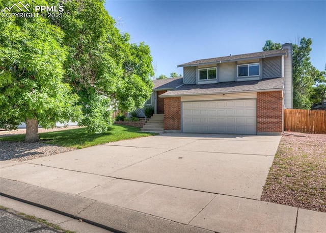 3730 Deep Haven Dr, Colorado Springs, CO 80920 - traditional-style house with concrete driveway, brick siding, an attached garage, and a chimney