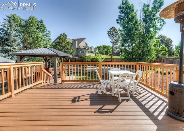 3730 Deep Haven Dr, Colorado Springs, CO 80920 - deck featuring outdoor dining space, a gazebo, and a fenced backyard