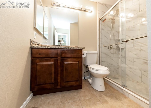 3730 Deep Haven Dr, Colorado Springs, CO 80920 - full bathroom featuring a stall shower, vanity, ceiling fan, and tile patterned floors
