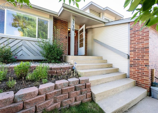3730 Deep Haven Dr, Colorado Springs, CO 80920 - property entrance with brick siding