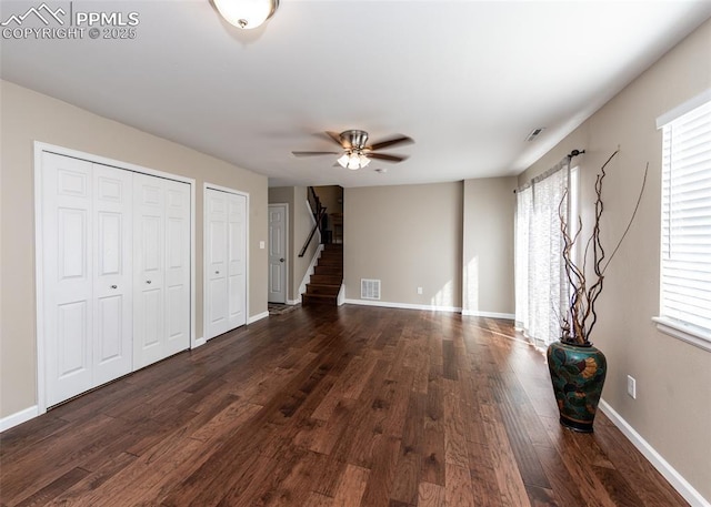 3730 Deep Haven Dr, Colorado Springs, CO 80920 - unfurnished living room featuring ceiling fan, stairway, and dark wood finished floors