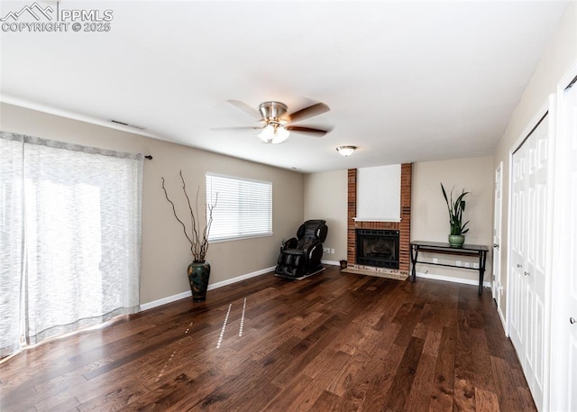 3730 Deep Haven Dr, Colorado Springs, CO 80920 - unfurnished room with ceiling fan, a brick fireplace, and wood finished floors
