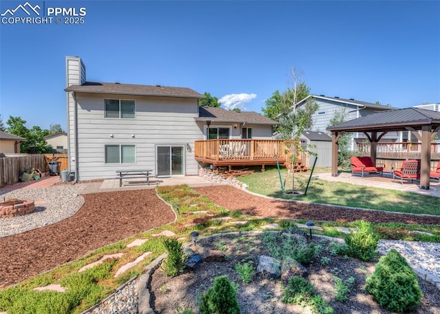 3730 Deep Haven Dr, Colorado Springs, CO 80920 - back of property featuring a gazebo, a patio, a fenced backyard, a wooden deck, and an outdoor fire pit