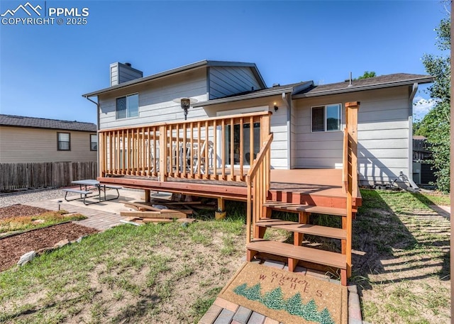 3730 Deep Haven Dr, Colorado Springs, CO 80920 - rear view of property featuring a chimney, a wooden deck, and a patio
