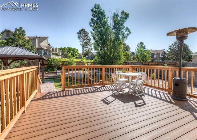 3730 Deep Haven Dr, Colorado Springs, CO 80920 - wooden terrace with a residential view, a fenced backyard, outdoor dining space, and a gazebo