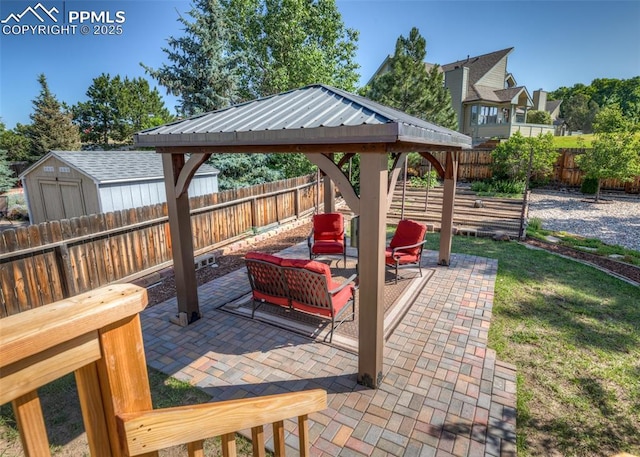 3730 Deep Haven Dr, Colorado Springs, CO 80920 - fenced backyard featuring a patio area, a gazebo, an outdoor living space, and a storage unit