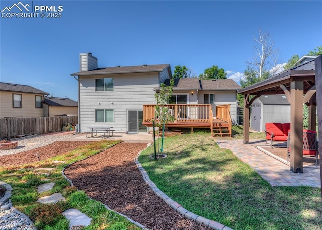 3730 Deep Haven Dr, Colorado Springs, CO 80920 - back of house with a storage unit, a patio area, a wooden deck, and a fenced backyard