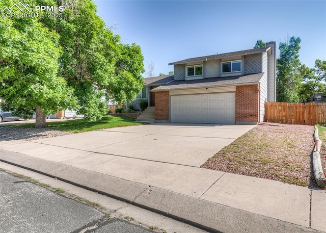 3730 Deep Haven Dr, Colorado Springs, CO 80920 - traditional-style house with a chimney, an attached garage, concrete driveway, and brick siding