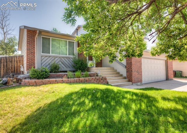 3730 Deep Haven Dr, Colorado Springs, CO 80920 - view of front facade with driveway, brick siding, and an attached garage