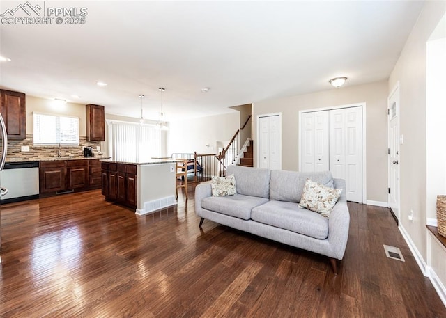 3730 Deep Haven Dr, Colorado Springs, CO 80920 - living area with dark wood-type flooring, stairs, and recessed lighting