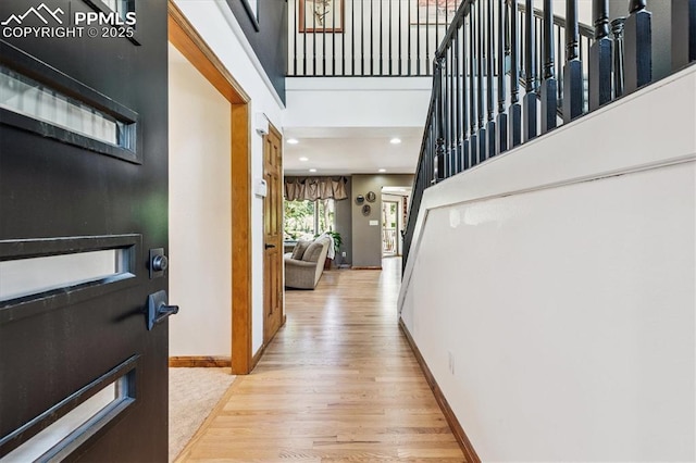 18971 Shadowood Dr, Monument, CO 80132 - entryway featuring light wood-style floors, a high ceiling, and recessed lighting