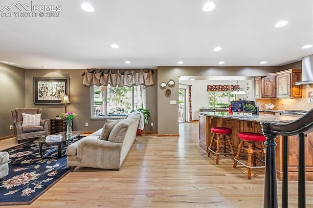 18971 Shadowood Dr, Monument, CO 80132 - living room featuring light wood-type flooring, healthy amount of natural light, and recessed lighting