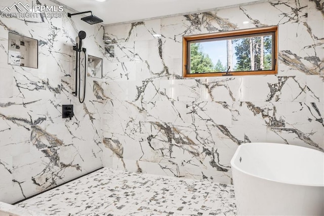 18971 Shadowood Dr, Monument, CO 80132 - bathroom with a freestanding bath, stone wall, a marble finish shower, and marble tiled floors