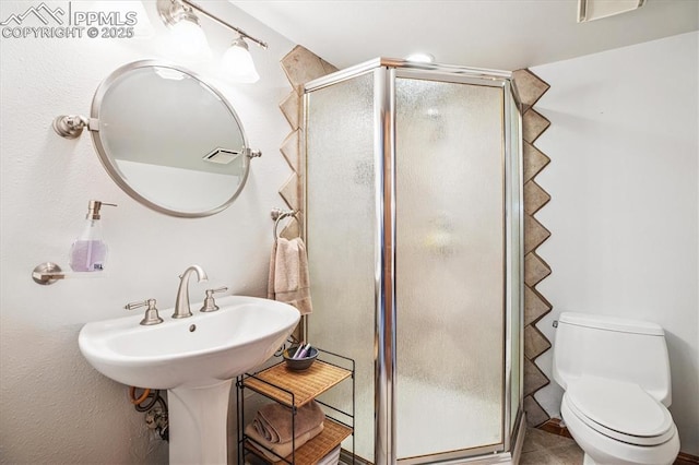18971 Shadowood Dr, Monument, CO 80132 - bathroom featuring a shower stall and toilet