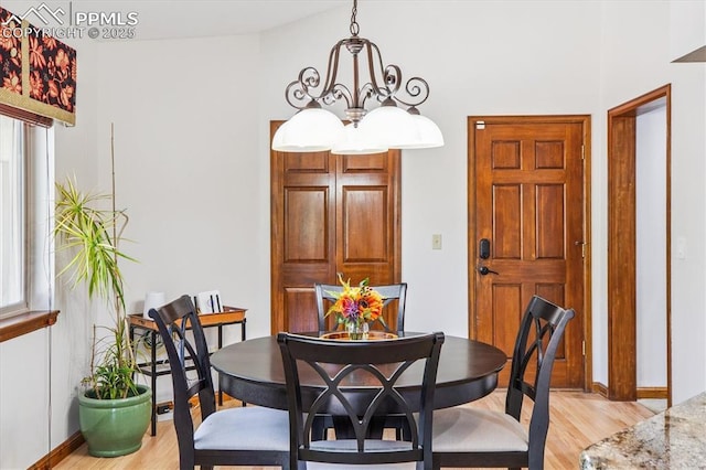 18971 Shadowood Dr, Monument, CO 80132 - dining space featuring light wood-type flooring and a chandelier