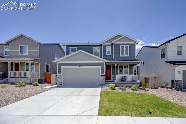 6237 Bodacious Cir, Colorado Springs, CO 80923 - craftsman inspired home with a porch, an attached garage, driveway, and stone siding