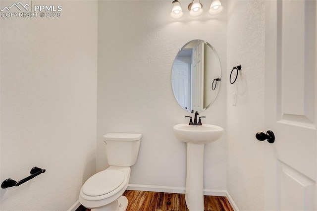 6237 Bodacious Cir, Colorado Springs, CO 80923 - bathroom featuring toilet and wood finished floors
