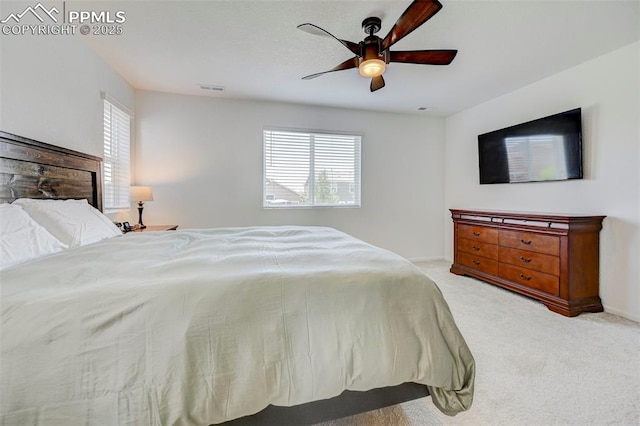 6237 Bodacious Cir, Colorado Springs, CO 80923 - bedroom featuring light colored carpet and ceiling fan