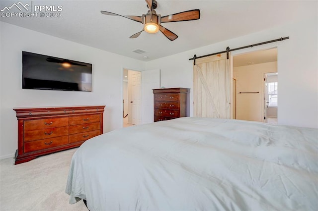 6237 Bodacious Cir, Colorado Springs, CO 80923 - bedroom with carpet flooring, a barn door, and ceiling fan