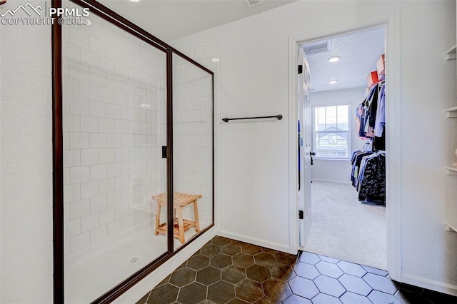 6237 Bodacious Cir, Colorado Springs, CO 80923 - bathroom with a stall shower and tile patterned flooring
