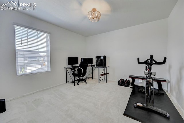 6237 Bodacious Cir, Colorado Springs, CO 80923 - workout room with a chandelier and carpet floors