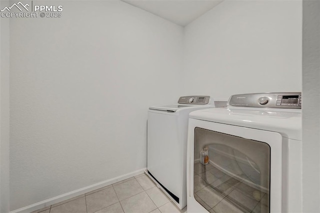 6237 Bodacious Cir, Colorado Springs, CO 80923 - laundry room featuring washer and dryer and light tile patterned floors