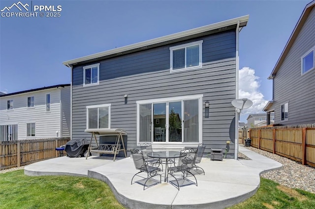 6237 Bodacious Cir, Colorado Springs, CO 80923 - back of house with a patio and a fenced backyard