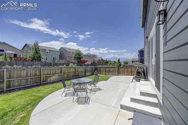 6237 Bodacious Cir, Colorado Springs, CO 80923 - fenced backyard featuring a residential view, a patio area, and outdoor dining space