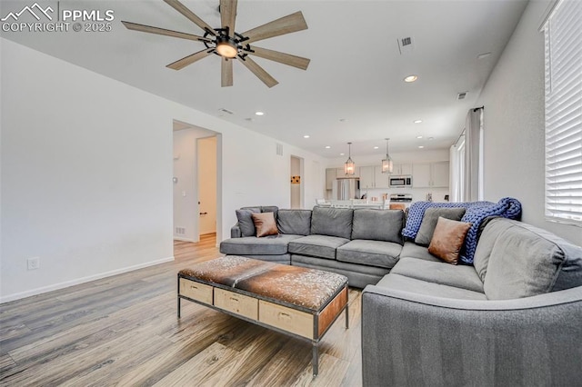 6237 Bodacious Cir, Colorado Springs, CO 80923 - living room with a ceiling fan, light wood-style flooring, and recessed lighting