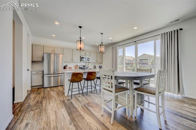 6237 Bodacious Cir, Colorado Springs, CO 80923 - dining space featuring light wood-style floors and recessed lighting