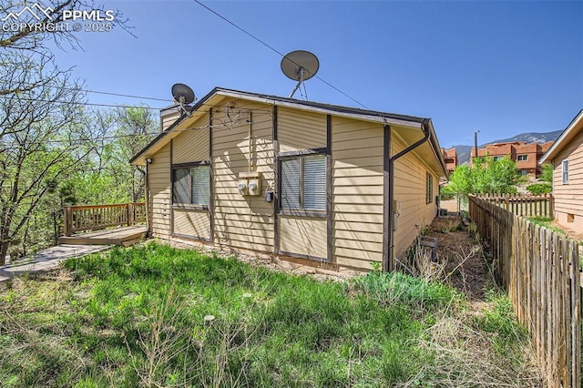 3324 W Kiowa St, Colorado Springs, CO 80904 - view of home's exterior featuring a chimney and a wooden deck