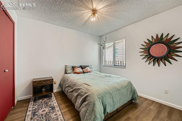 3324 W Kiowa St, Colorado Springs, CO 80904 - bedroom with wood finished floors and a textured ceiling