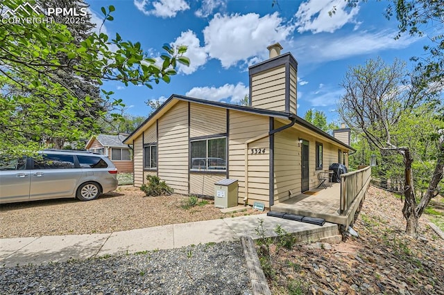 3324 W Kiowa St, Colorado Springs, CO 80904 - view of home's exterior featuring a chimney