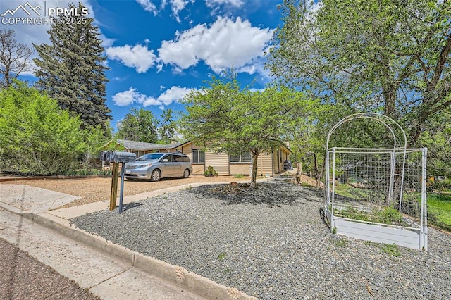 3324 W Kiowa St, Colorado Springs, CO 80904 - view of front facade with a vegetable garden