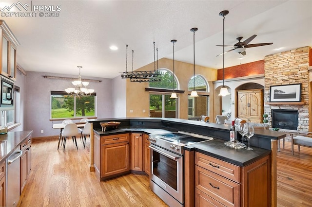 20401 High Pines Dr, Monument, CO 80132 - kitchen with appliances with stainless steel finishes, healthy amount of natural light, ceiling fan, dark countertops, and recessed lighting