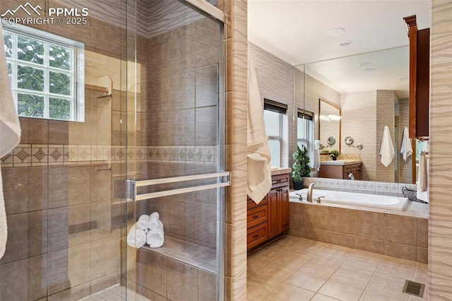 20401 High Pines Dr, Monument, CO 80132 - full bath with vanity, tile patterned flooring, a shower stall, and a garden tub