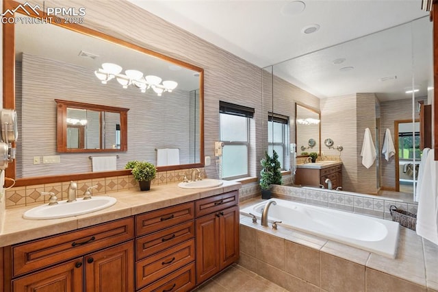 20401 High Pines Dr, Monument, CO 80132 - full bathroom featuring double vanity, a garden tub, and tile patterned flooring