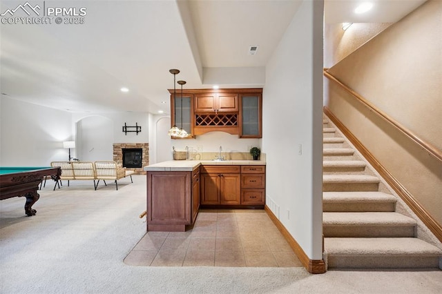 20401 High Pines Dr, Monument, CO 80132 - indoor wet bar featuring light colored carpet, stairs, pool table, recessed lighting, and pendant lighting