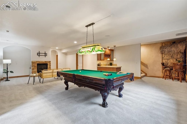 20401 High Pines Dr, Monument, CO 80132 - playroom with light carpet, a bar, billiards, a stone fireplace, and recessed lighting