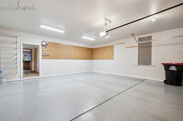 20401 High Pines Dr, Monument, CO 80132 - garage featuring a garage door opener and baseboards