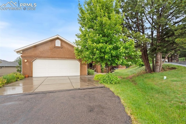 20401 High Pines Dr, Monument, CO 80132 - view of front of property with concrete driveway, a front lawn, stucco siding, and a garage