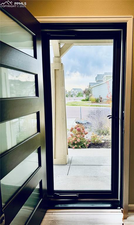 6640 Backcountry Loop, Colorado Springs, CO 80927 - doorway to outside featuring plenty of natural light