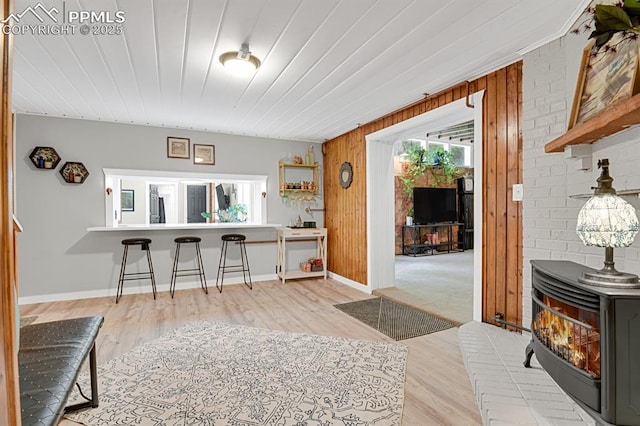 4540 Fountain Ave, Cascade, CO 80809 - interior space with a wood stove, wood finished floors, wood ceiling, and wood walls