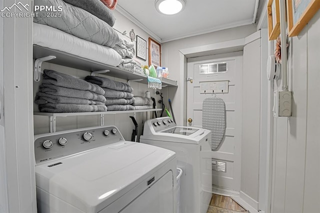 4540 Fountain Ave, Cascade, CO 80809 - laundry room with washer and clothes dryer and ornamental molding