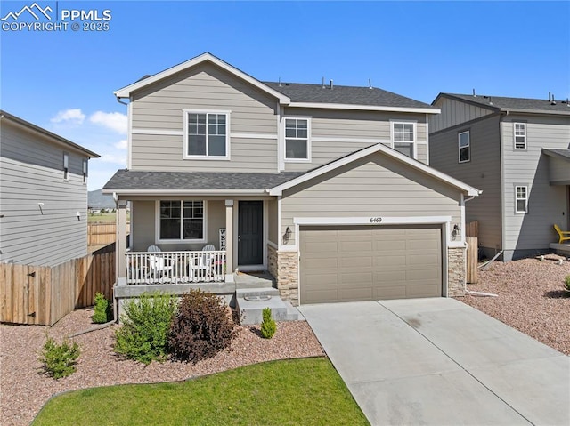 6469 Bodacious Cir, Colorado Springs, CO 80923 - view of front of property featuring a porch, driveway, and roof with shingles