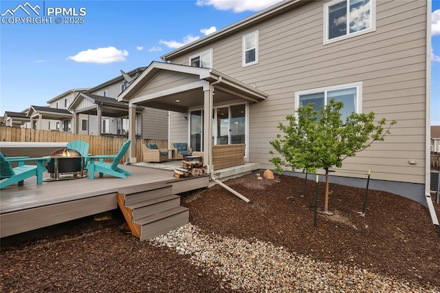 6469 Bodacious Cir, Colorado Springs, CO 80923 - rear view of house with a fire pit and a deck